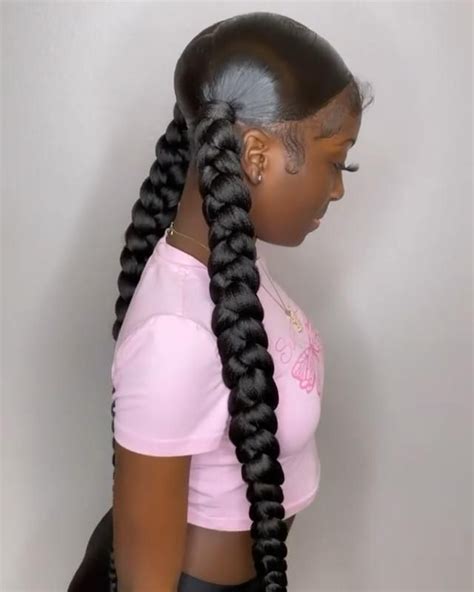 sleek ponytail with braiding hair|two sleek braided ponytails.